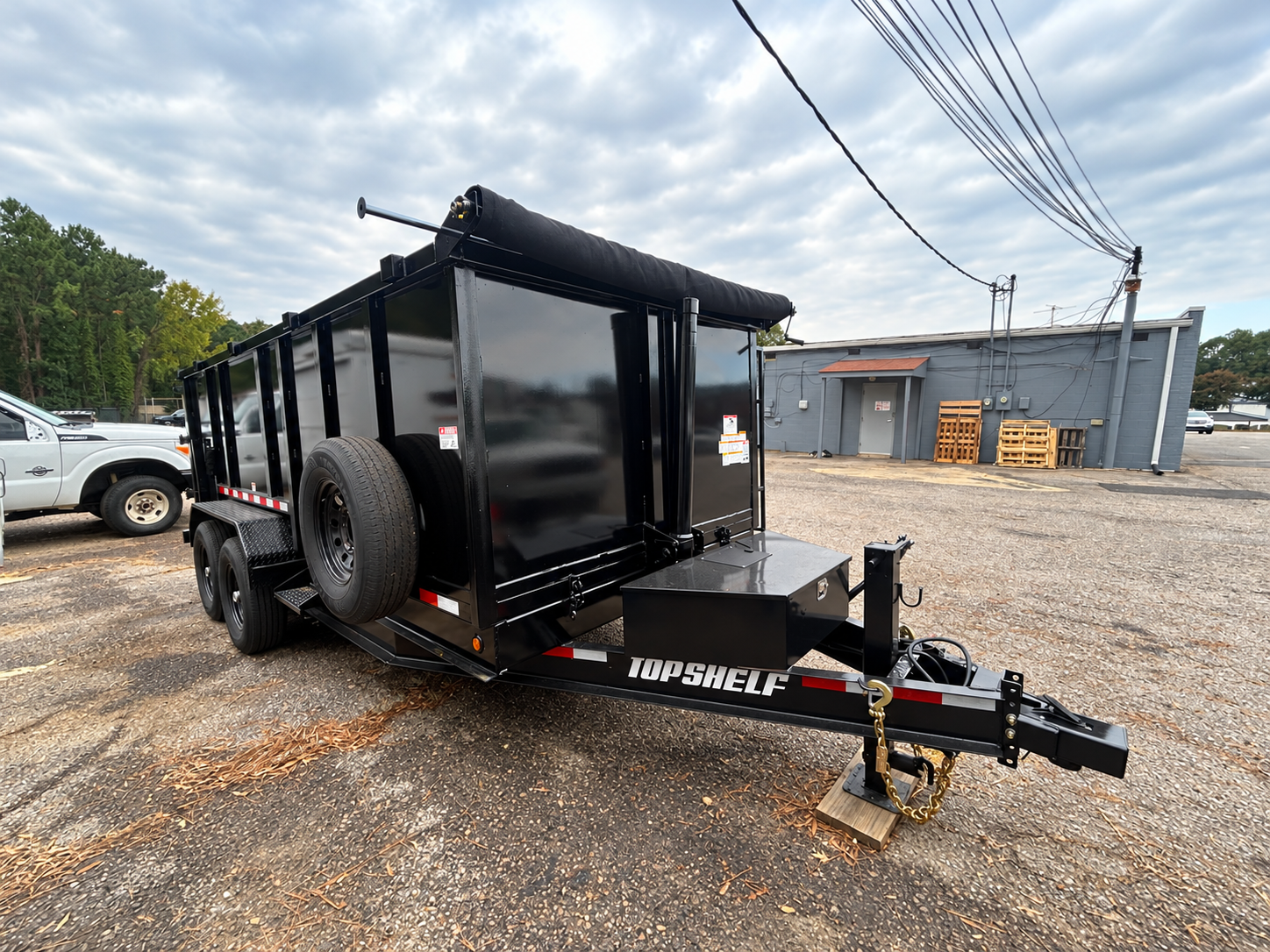 Front-angled view of Archer Transport Co.'s black dump trailer